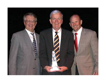 Mike Hastings, Tom Sampson, and Rich Mills receive the Pinnacle Award from Pinncale health association.